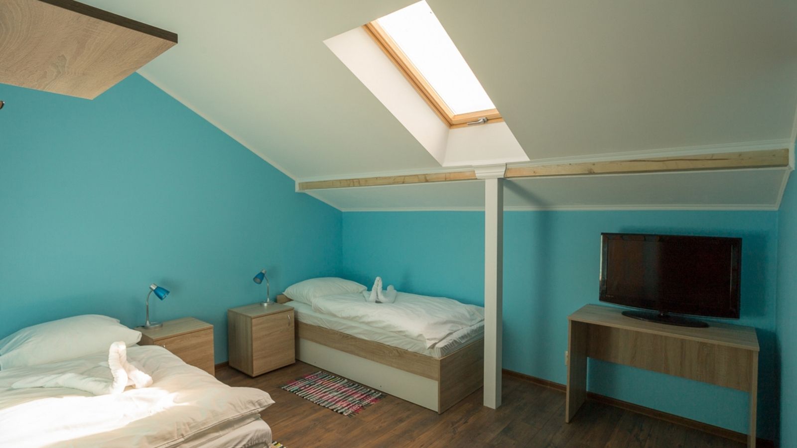 How do you make a room with slanted walls look bigger